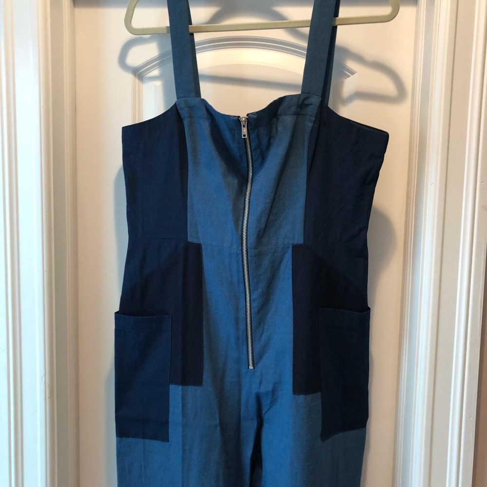 BCBG chambray jumpsuit with front pockets.